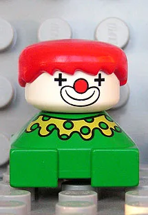 Duplo 2x2x2 Figurenstein, Clown, grüner Sockel, gelbes Halsband mit grünen Punkten, weißer Kopf, rote Haare