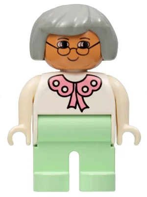 Duplo-Figur, weiblich, hellgrüne Beine, weiße Bluse, graue Haare, Brille