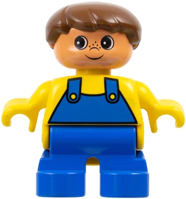 Figurine Duplo - Garçon, jambes bleues, haut jaune à motifs salopette, cheveux bruns, tête couleur nougat (75487)