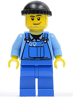 Overalls met gereedschap in de zak, blauw, zwarte gebreide muts, grijns en stoppelbaard.